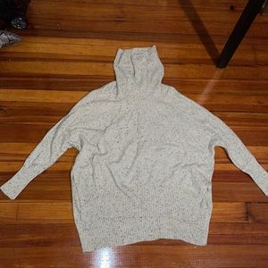 Quarter sleeved turtleneck sweater